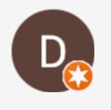 A brown circle with an orange star in the middle.
